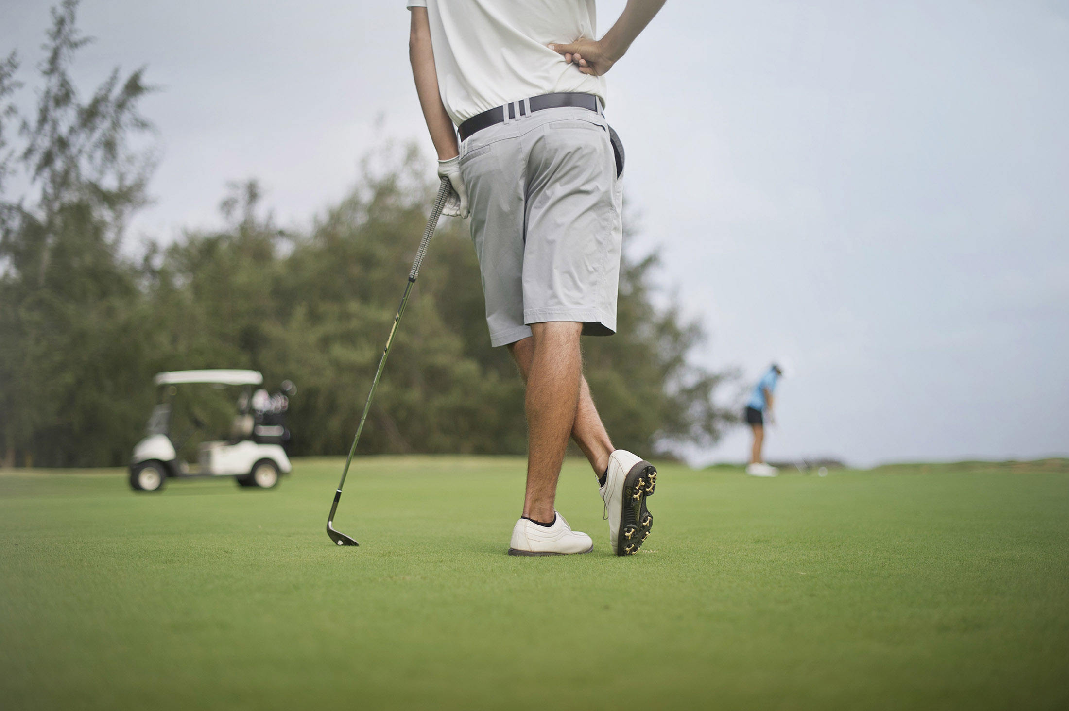 Golfer standing on the course