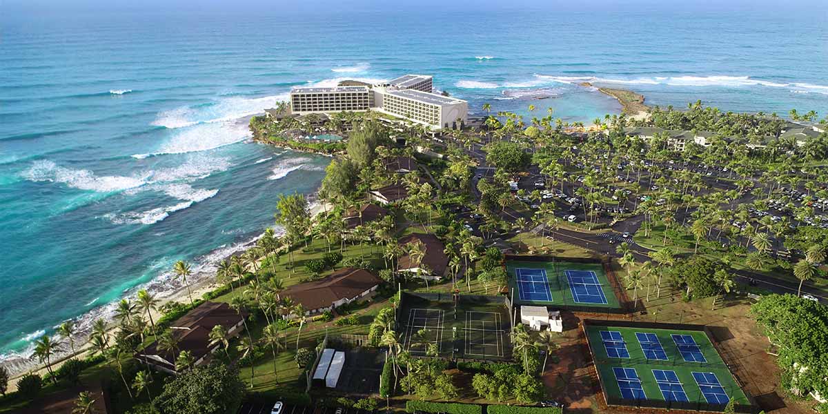 An aerial view of Turtle Bay Resort and their tennis courts