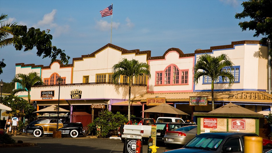 A commercial building with cars parked in front