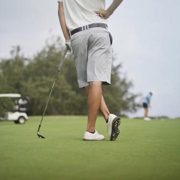 Golfer standing on the course